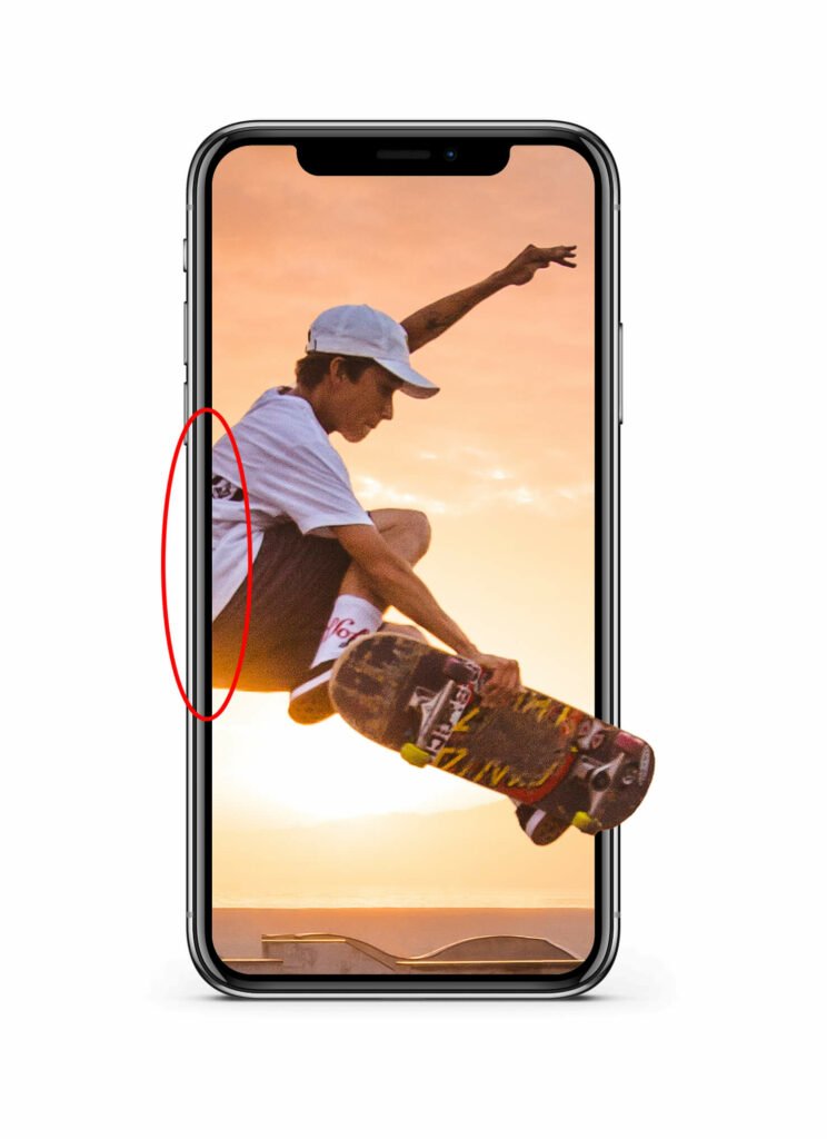 Paint over that area to remove part of the skater's back and give the impression that he's popping out of the phone's screen.